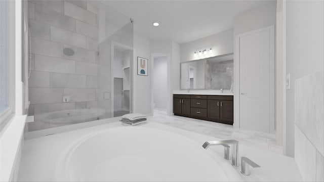21119 Flowerhorn Dr, Cypress, TX 77433 - bathroom featuring vanity, a bath, tiled shower, and recessed lighting