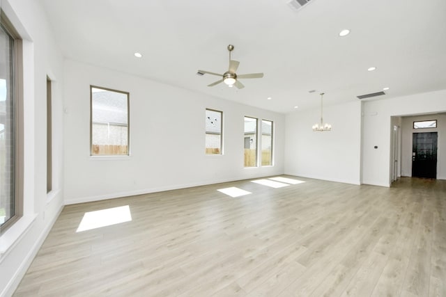 21122 Flowerhorn Dr, Cypress, TX 77433 - unfurnished living room with a chandelier, light wood-style floors, recessed lighting, ceiling fan, and baseboards