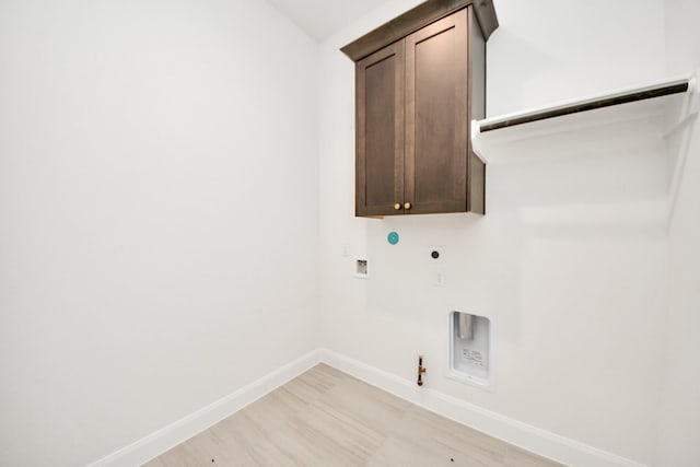 21122 Flowerhorn Dr, Cypress, TX 77433 - laundry area featuring gas dryer hookup, hookup for an electric dryer, baseboards, cabinet space, and hookup for a washing machine