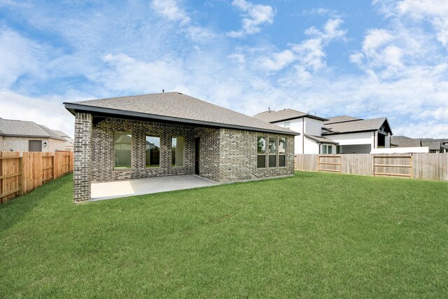 21122 Flowerhorn Dr, Cypress, TX 77433 - back of house featuring brick siding, a patio, and roof with shingles