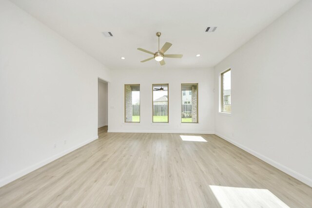 21122 Flowerhorn Dr, Cypress, TX 77433 - spare room with light wood finished floors, a ceiling fan, baseboards, and recessed lighting