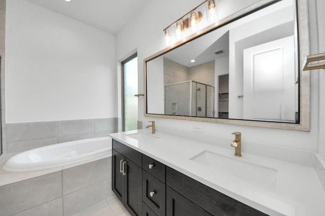 21114 Regal Terrace Dr, Cypress, TX 77433 - bathroom featuring a shower stall, a garden tub, and double vanity