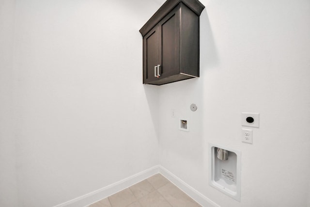 21114 Regal Terrace Dr, Cypress, TX 77433 - washroom with hookup for an electric dryer, baseboards, hookup for a washing machine, hookup for a gas dryer, and cabinet space