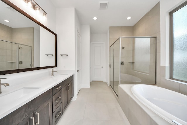 21130 Flowerhorn Dr, Cypress, TX 77433 - full bath featuring a garden tub, a shower stall, double vanity, tile patterned flooring, and recessed lighting