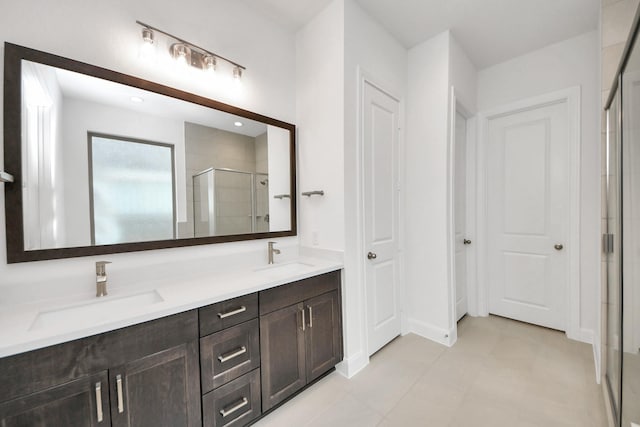 21130 Flowerhorn Dr, Cypress, TX 77433 - bathroom featuring a shower stall, double vanity, and tile patterned floors