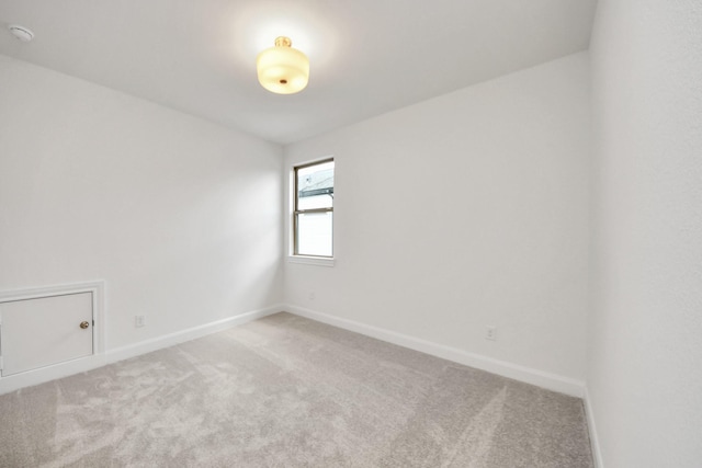 21130 Flowerhorn Dr, Cypress, TX 77433 - empty room with light carpet, baseboards, and a smoke detector