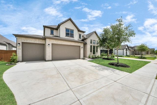 21130 Flowerhorn Dr, Cypress, TX 77433 - view of front of house featuring concrete driveway, stucco siding, an attached garage, and a garage