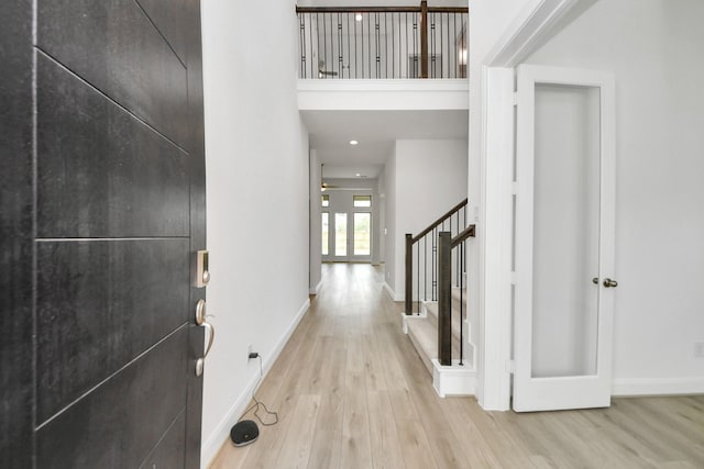 21130 Flowerhorn Dr, Cypress, TX 77433 - foyer with wood finished floors, baseboards, and stairway