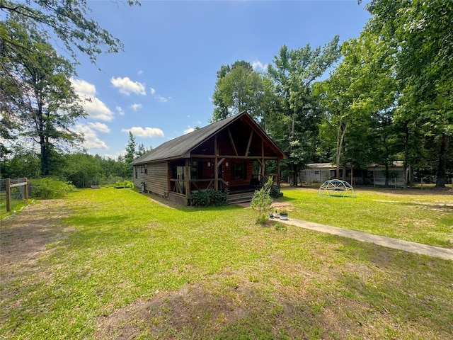 798 Port Blvd, Trinity, TX 75862 - back of house with a yard and covered porch