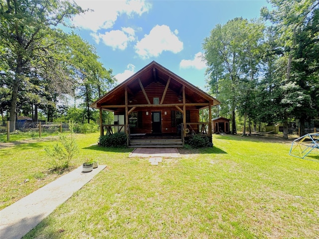 798 Port Blvd, Trinity, TX 75862 - rear view of house featuring covered porch and log veneer siding