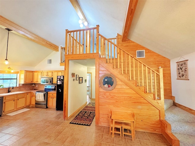798 Port Blvd, Trinity, TX 75862 - stairway featuring high vaulted ceiling, wood walls, beam ceiling, baseboards, and tile patterned flooring