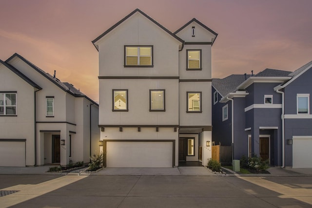1930 Pueblo Nuevo Path, Houston, TX 77077 - view of front facade with stucco siding, concrete driveway, and an attached garage