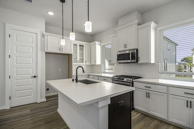 1930 Pueblo Nuevo Path, Houston, TX 77077 - kitchen featuring stainless steel appliances, a sink, decorative backsplash, plenty of natural light, and recessed lighting