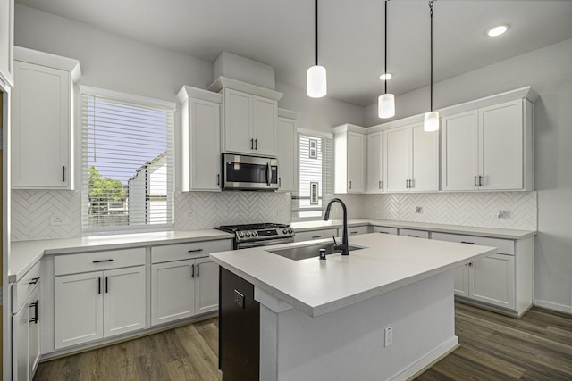 1930 Pueblo Nuevo Path, Houston, TX 77077 - kitchen featuring appliances with stainless steel finishes, a sink, backsplash, white cabinets, and recessed lighting