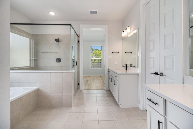 1930 Pueblo Nuevo Path, Houston, TX 77077 - bathroom with vanity, tile patterned floors, a shower stall, a bath, and baseboards