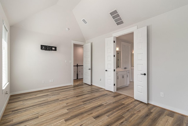 1930 Pueblo Nuevo Path, Houston, TX 77077 - unfurnished bedroom with high vaulted ceiling, wood finished floors, multiple windows, and baseboards