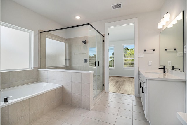 1930 Pueblo Nuevo Path, Houston, TX 77077 - bathroom with vanity, a garden tub, tile patterned flooring, a stall shower, and recessed lighting