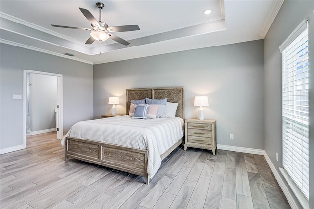 8105 Denali Dr, Corpus Christi, TX 78414 - bedroom featuring a tray ceiling, light wood-style flooring, baseboards, and crown molding