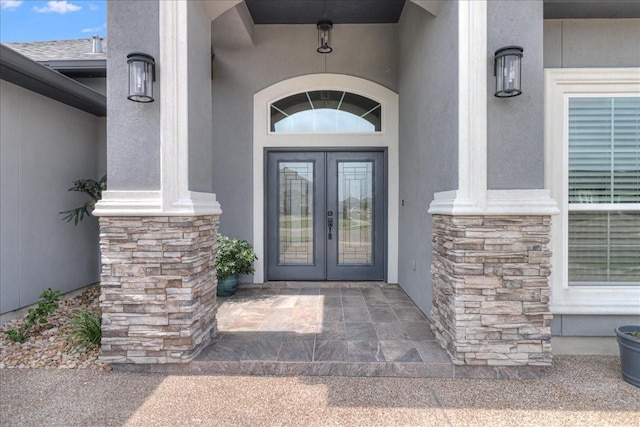 8105 Denali Dr, Corpus Christi, TX 78414 - entrance to property with french doors, stone siding, and stucco siding