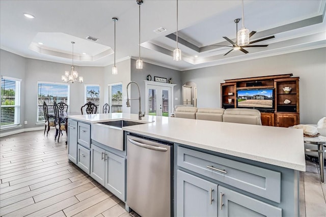 8105 Denali Dr, Corpus Christi, TX 78414 - kitchen featuring stainless steel dishwasher, a tray ceiling, gray cabinets, a sink, and a ceiling fan