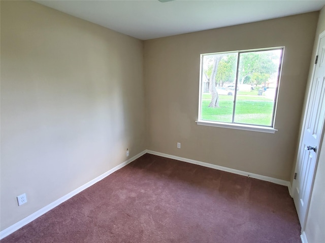 4919 Redfish Reef St, Bacliff, TX 77518 - spare room featuring dark carpet and baseboards