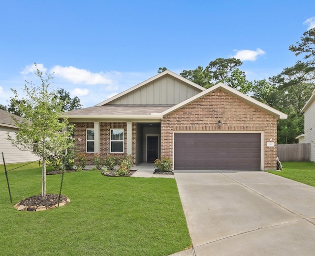 3511 Queensberry Ct, Huffman, TX 77336 - view of front of house featuring a garage, brick siding, driveway, and board and batten siding