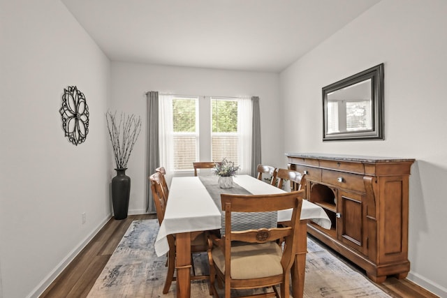 3511 Queensberry Ct, Huffman, TX 77336 - dining area featuring dark wood-style floors and baseboards
