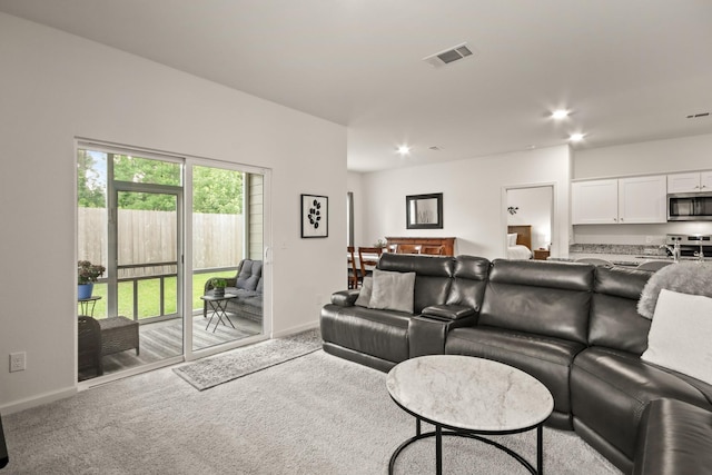 3511 Queensberry Ct, Huffman, TX 77336 - carpeted living room with baseboards and recessed lighting