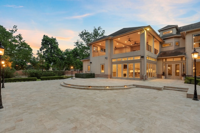 16 Grand Mnr, Sugar Land, TX 77479 - rear view of house with a balcony, french doors, ceiling fan, a patio area, and stucco siding