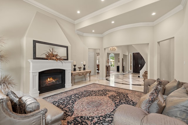 16 Grand Mnr, Sugar Land, TX 77479 - living area with recessed lighting, marble tiled floors, a towering ceiling, a fireplace with flush hearth, and crown molding