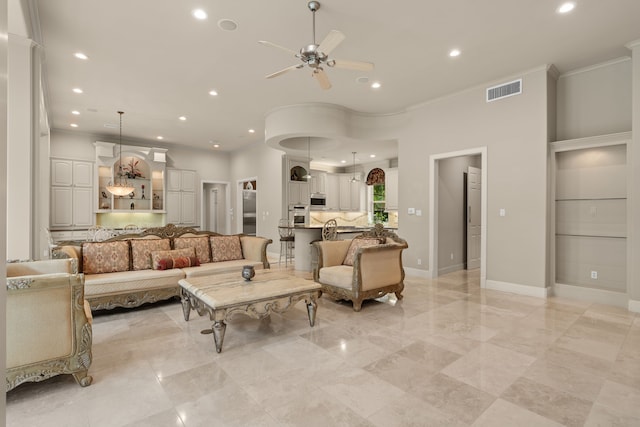 16 Grand Mnr, Sugar Land, TX 77479 - living room with a ceiling fan, recessed lighting, crown molding, baseboards, and light marble finish floors