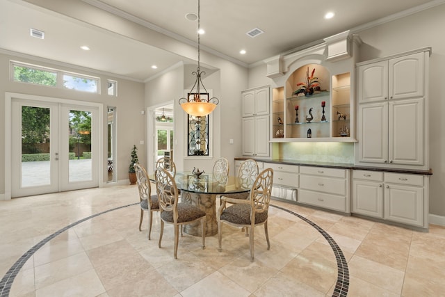 16 Grand Mnr, Sugar Land, TX 77479 - dining area with inlaid floor details, recessed lighting, crown molding, french doors, and baseboards