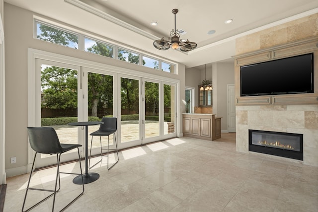 16 Grand Mnr, Sugar Land, TX 77479 - living area with a chandelier, recessed lighting, a fireplace, a high ceiling, and baseboards