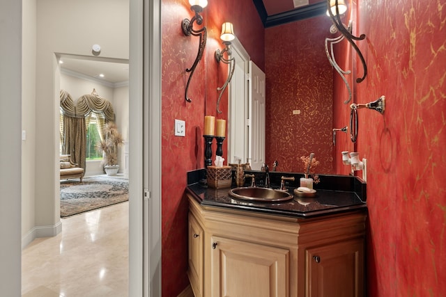 16 Grand Mnr, Sugar Land, TX 77479 - bathroom featuring ornamental molding, vanity, and baseboards