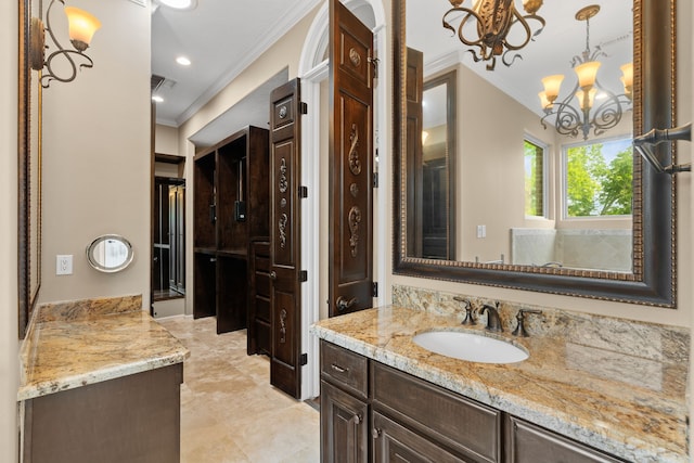 16 Grand Mnr, Sugar Land, TX 77479 - bathroom with crown molding, a chandelier, vanity, and tile patterned floors