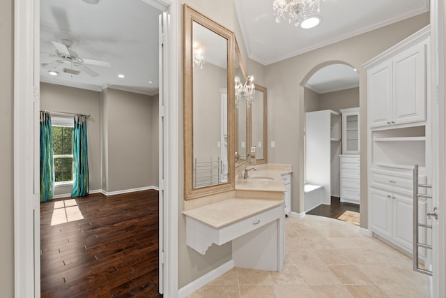 16 Grand Mnr, Sugar Land, TX 77479 - full bath featuring vanity, crown molding, a ceiling fan, baseboards, and a chandelier
