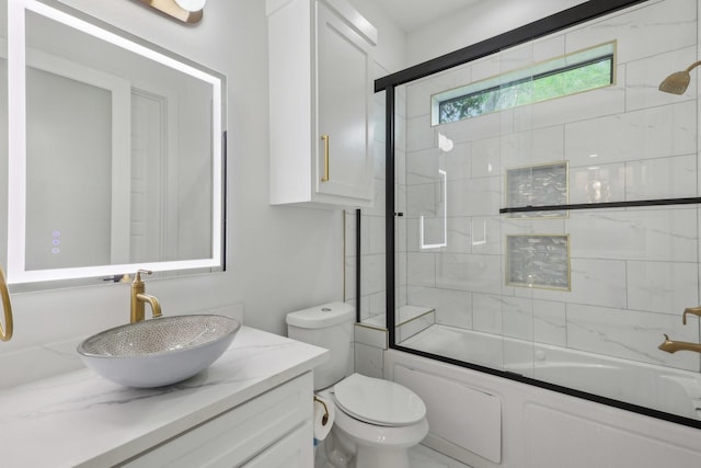 3505 Cobb St, Houston, TX 77004 - bathroom featuring vanity, shower / bath combination with glass door, and toilet