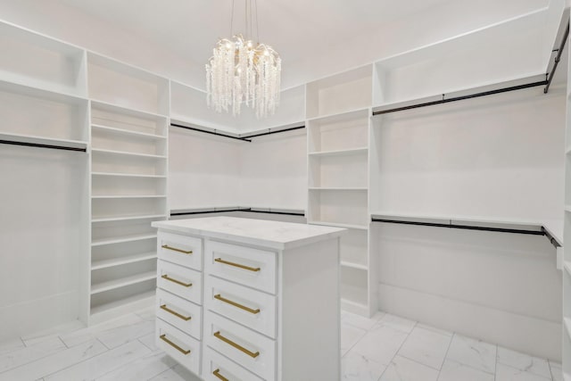 3505 Cobb St, Houston, TX 77004 - walk in closet with light marble finish flooring and a chandelier
