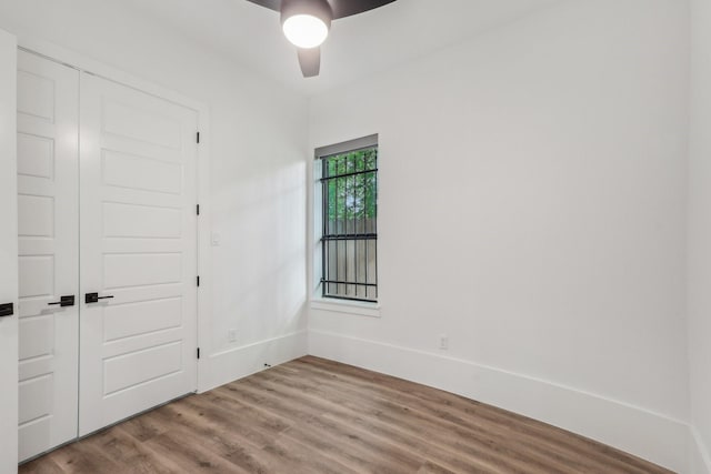 3505 Cobb St, Houston, TX 77004 - unfurnished bedroom featuring wood finished floors, a closet, a ceiling fan, and baseboards