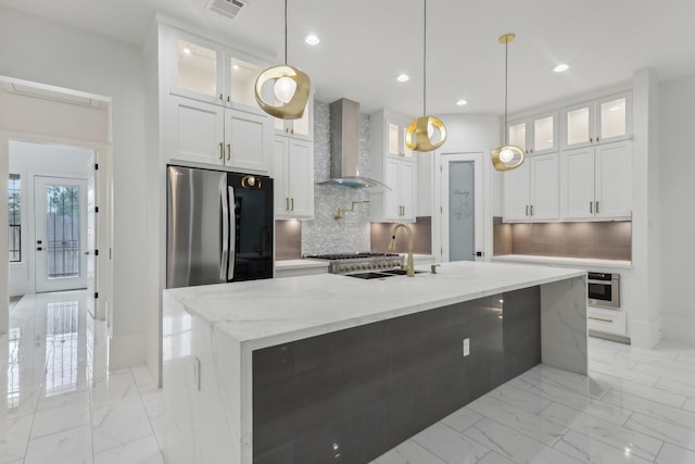 3505 Cobb St, Houston, TX 77004 - kitchen with wall chimney range hood, freestanding refrigerator, a sink, light marble finish flooring, and recessed lighting