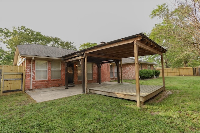 3911 Cypress Lake Dr, Spring, TX 77388 - rear view of property with brick siding, a deck, a gate, roof with shingles, and a patio