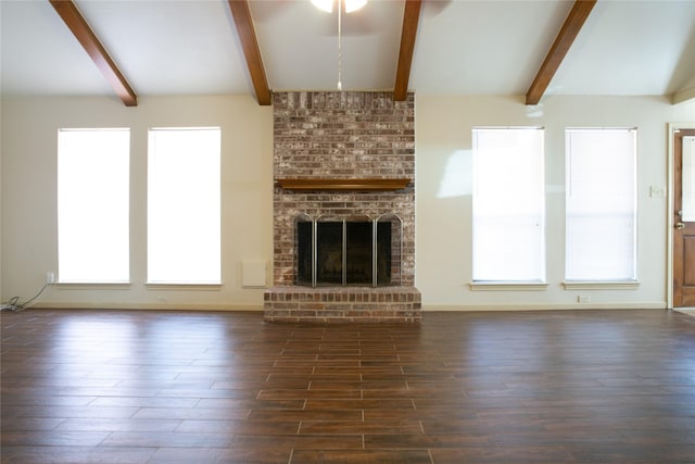 3911 Cypress Lake Dr, Spring, TX 77388 - unfurnished living room featuring beam ceiling, wood finished floors, a fireplace, and baseboards