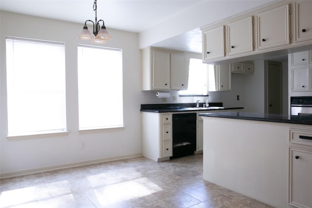 3911 Cypress Lake Dr, Spring, TX 77388 - kitchen with black dishwasher, stainless steel oven, dark countertops, decorative light fixtures, and a sink