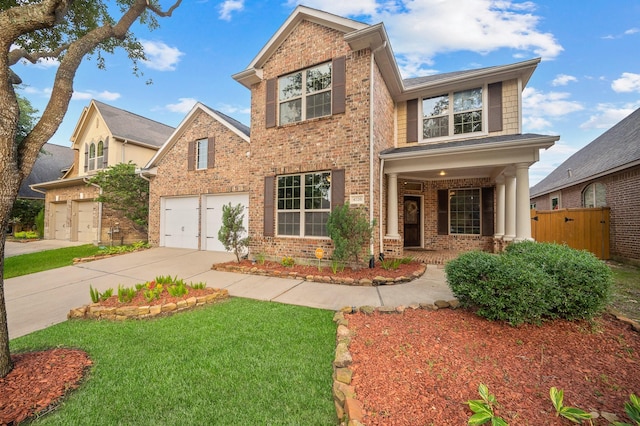 4726 Ashley Hope Dr, Katy, TX 77494 - view of front of home featuring brick siding, driveway, an attached garage, and covered porch