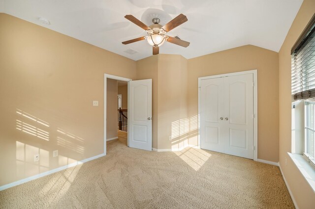 4726 Ashley Hope Dr, Katy, TX 77494 - unfurnished bedroom featuring carpet flooring, baseboards, a ceiling fan, vaulted ceiling, and a closet