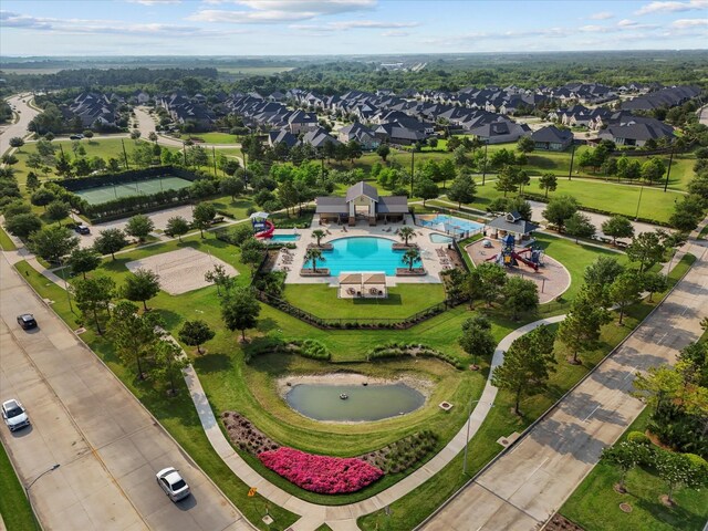 3435 Limestone Sky Ct, Houston, TX 77059 - aerial perspective of suburban area with a pool area and a large body of water