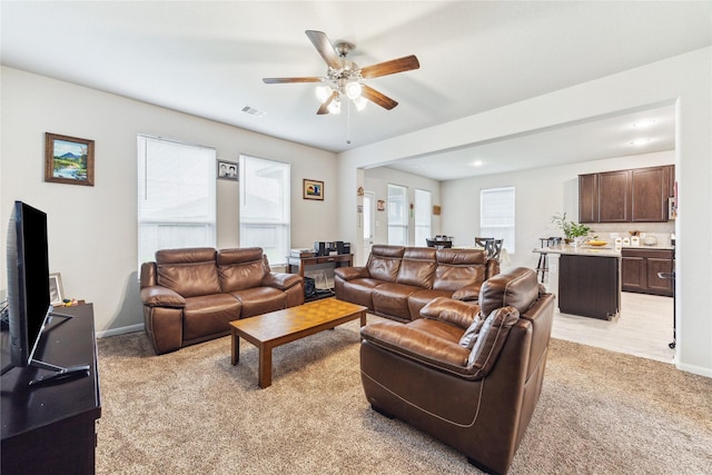 922 Steel Blue Dr, Houston, TX 77073 - living room featuring light carpet, a ceiling fan, baseboards, and recessed lighting