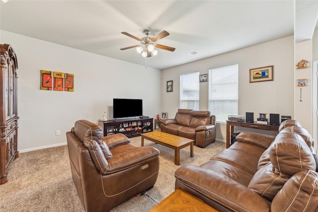 922 Steel Blue Dr, Houston, TX 77073 - living room featuring a ceiling fan, baseboards, and light colored carpet