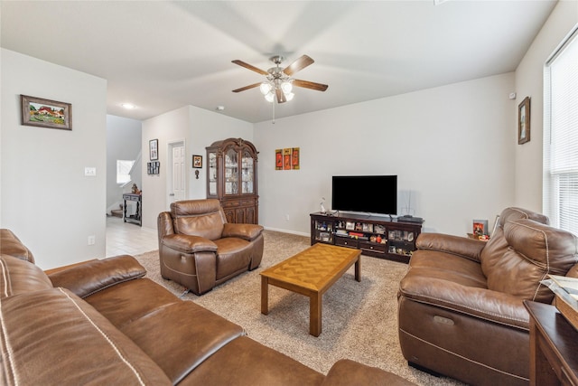 922 Steel Blue Dr, Houston, TX 77073 - living area featuring ceiling fan, light colored carpet, and baseboards
