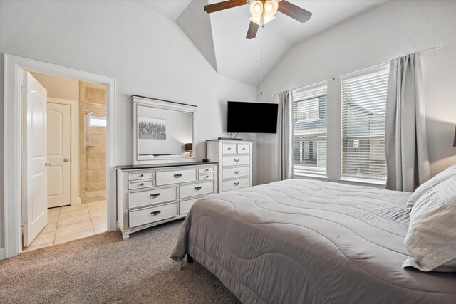 2020 Millbridge Spring Ln, Houston, TX 77051 - bedroom featuring vaulted ceiling, light carpet, connected bathroom, light tile patterned flooring, and a ceiling fan
